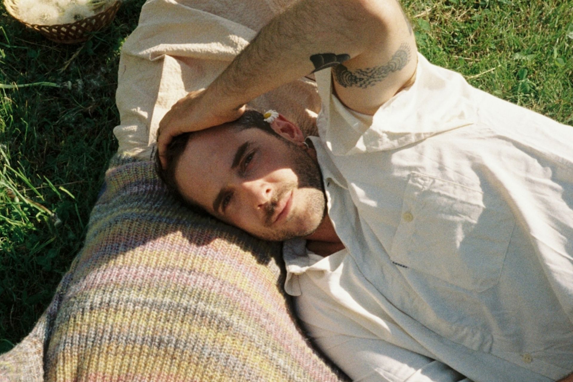 man covering eyes